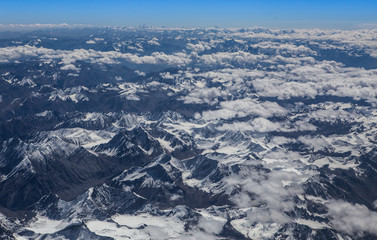 Himalaya mountains under clouds