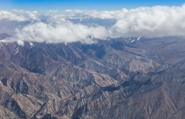 Himalaya mountains under clouds