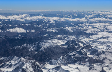 Himalaya mountains under clouds