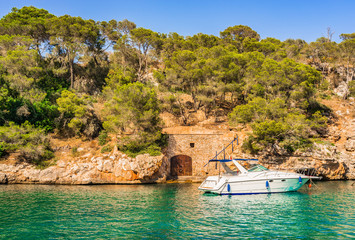 Boat anchoring  in harbor of Cala Figuera Majorca Spain