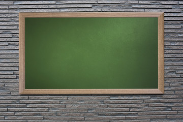 Blank old school blackboard on a grunge wall and can input text