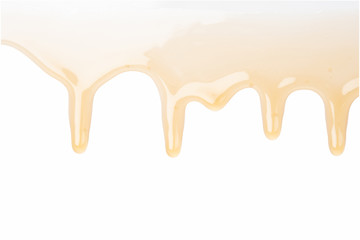 honey drops on white