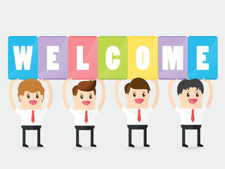 collaborative team work of businessman carrying sign board with word WELCOME