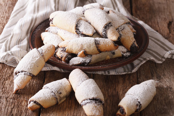 crescent with poppy stuffing close-up on a plate. Horizontal
