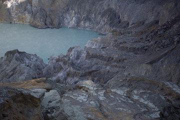 Naklejka premium The acid sulphur lake at Kawah Ijen crater. Indonesia