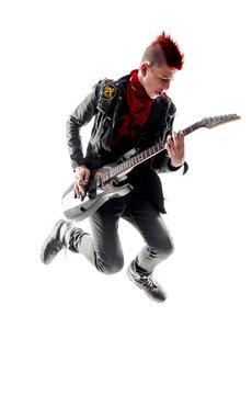 Wild Teen Boy With Red Haired Mohawk Playing Guitar While Jumping. Isolated