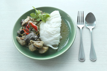 Curry chicken noodles (KHANOM CHIN) with vegetable.