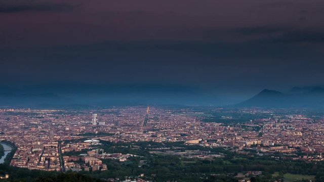 timelapse of turin city skyline from night to day aerial view zoom out