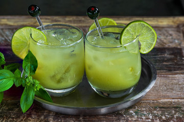 Iced green tea cocktail with tequila and lemon