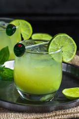 Iced green tea cocktail with tequila and lemon