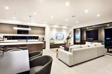 Modern living room with a television and sofas and pillows