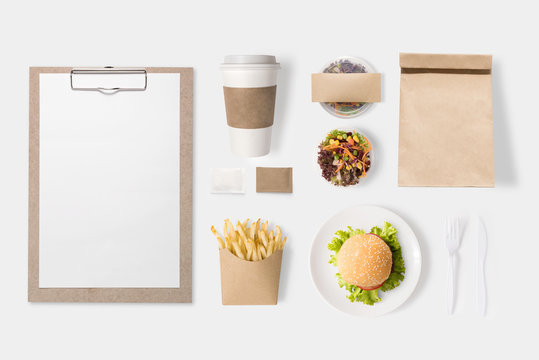 Design concept of mockup burger, salad, coffee cup, french fries set isolated on white background. Copy space for text and logo. Clipping Path included on white background.