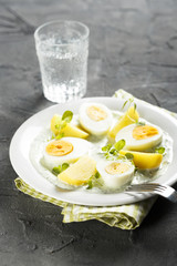 Boiled potato with eggs and green herbal sauce

