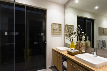 Luxury washroom with lights on at night