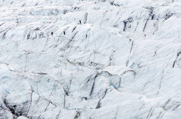 people hiking on glacier in Iceland