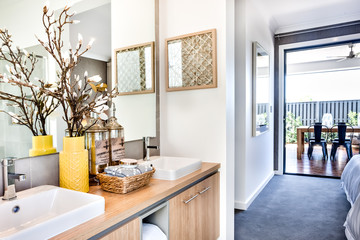 Modern washroom and the hallway to an outside patio area