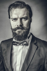 Portrait of a fashionable young man with retro look