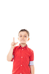 Portrait of a happy boy pointing up