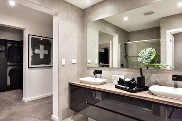 Fototapeta na wymiar Modern bathroom closeup to a mirror and countertop