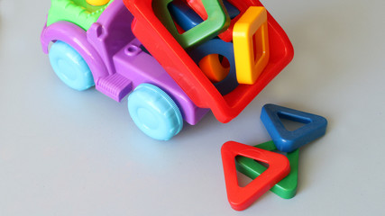truck toy and colored shapes