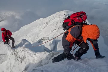 Rolgordijnen Alpinisme Climbing in mountains. Team work.