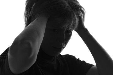 isolated black and white portrait of woman in despair grabbed hold of the hair