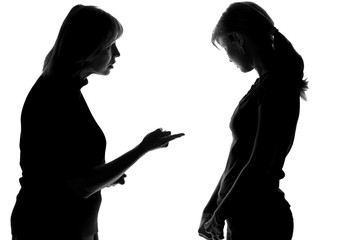 black and white silhouette of a mother who scolds and makes inexperienced daughter