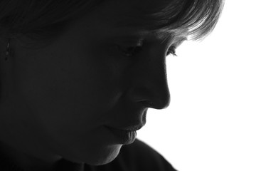 isolated black and white portrait of a woman experiencing negative emotions