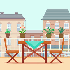 Table and chairs on the balcony.