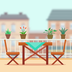 Table and chairs on the balcony.
