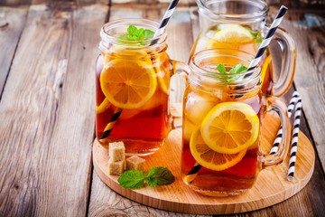 ice tea with slice of lemon in mason jar