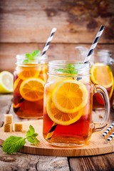 ice tea with slice of lemon in mason jar