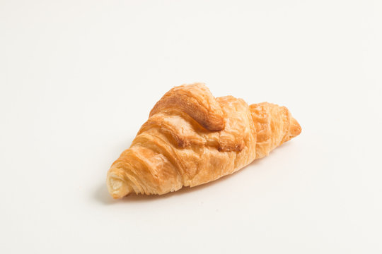gold croissant isolated on white background