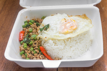 Rice topped with stir fried minced pork and basil. Thai food