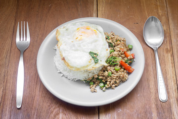 Rice topped with stir fried minced pork and basil. Thai food