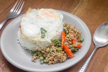 Rice topped with stir fried minced pork and basil. Thai food