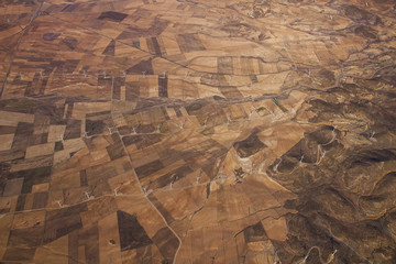 Wind-mills around across the fields of south Spain. Picture made of hot air balloon.