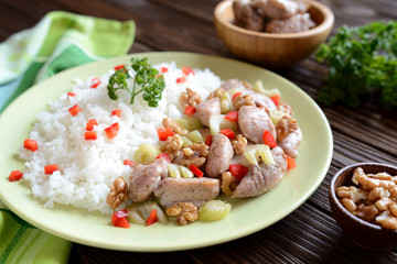 Roasted chicken meat with stalk celery, roasted walnuts and rice