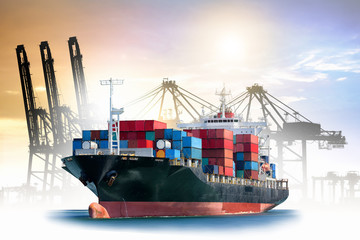Fototapeta premium Logistics and transportation of International Container Cargo ship with ports crane bridge in harbor for logistic import export background and transport industry.