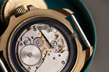Macro view clock mechanism with gears. wristwatch details. Shallow depth of field