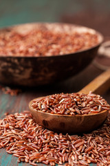 The spoon with red rice