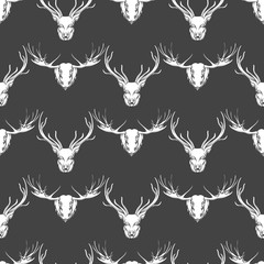 White and grey seamless pattern with deer and elk heads. Vector illustration