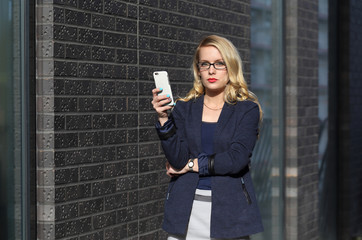 Young business woman with mobile phone