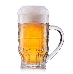 Frosty glass of light beer isolated on a white background