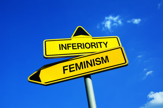 Inferiority or Feminism - Traffic sign with two options - appeal to fight against male chauvinism, dominance and oppression. Emancipation and equality of women and female gender