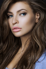 Naklejka premium a large portrait of a sexy and beautiful girl with a professiona