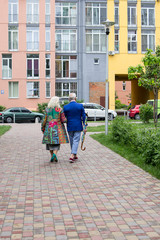 Elegant elderly couple walking outdoors