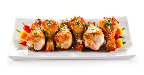 Roast chicken drumsticks and vegetables