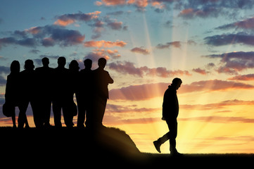 Silhouettes of people crowd expel the man from their community.