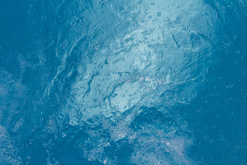 Beautiful pattern of blue water reflecting the sun.